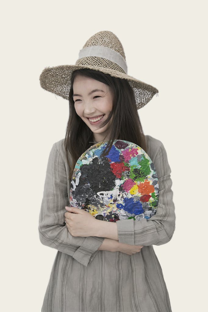 Woman Wearing Brown Sun Hat and Gray Pinstriped Long-sleeved Long Dress